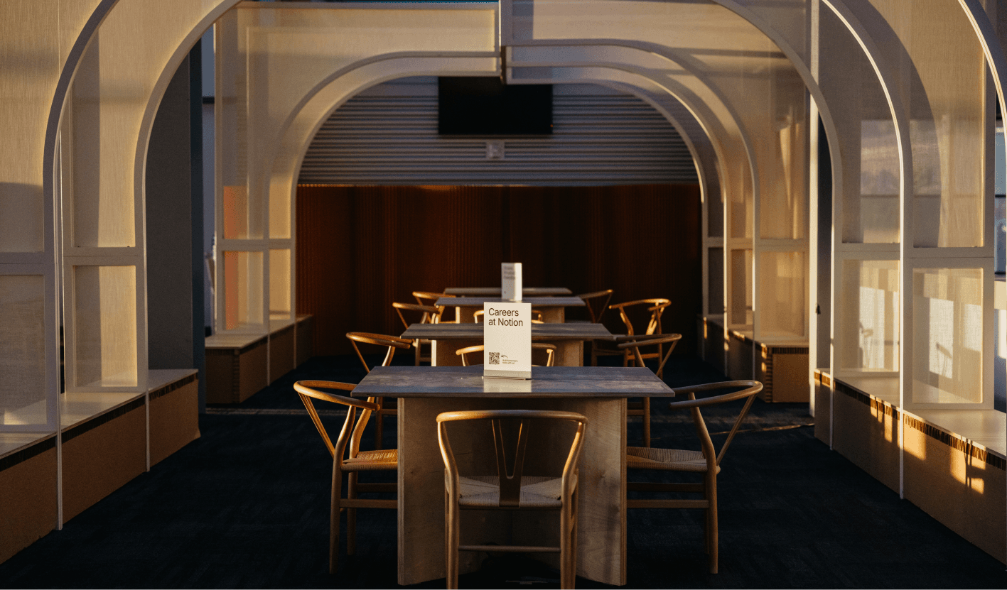 The soft morning light filtering through the suspended translucent fabric scrims.